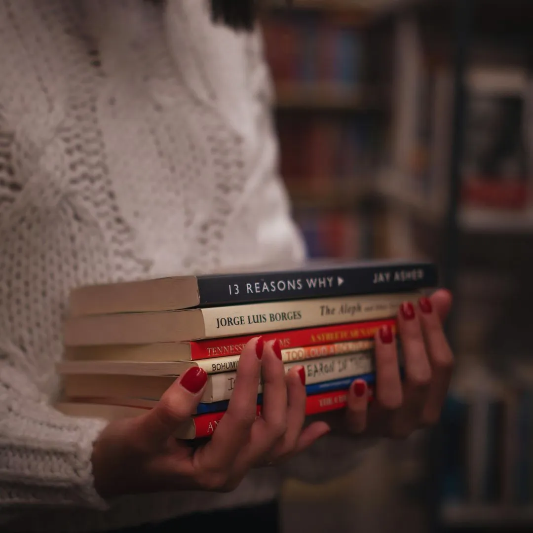 Sad Girl Books Photo by Masoud Mostafaei from Pexels