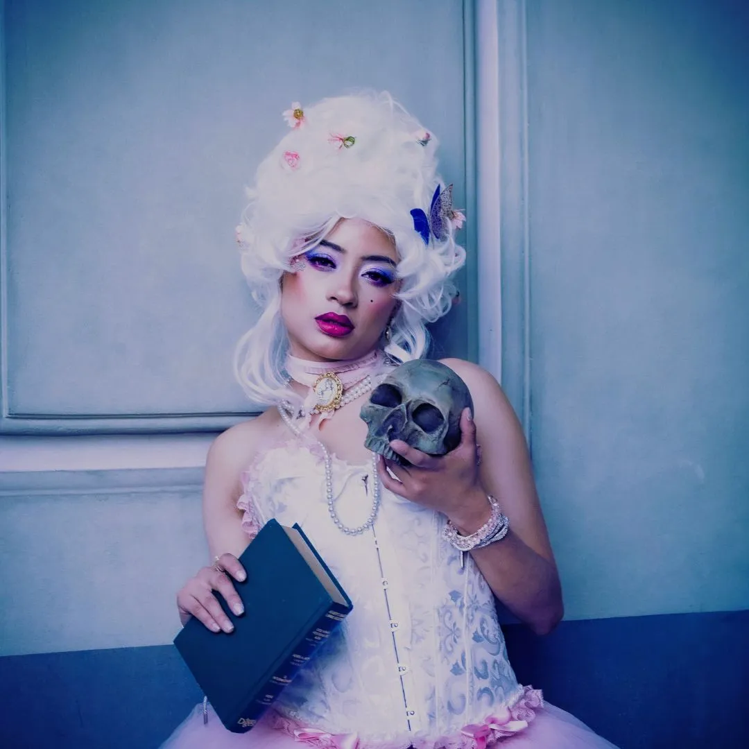 reading body horror genre girl with a book and skull