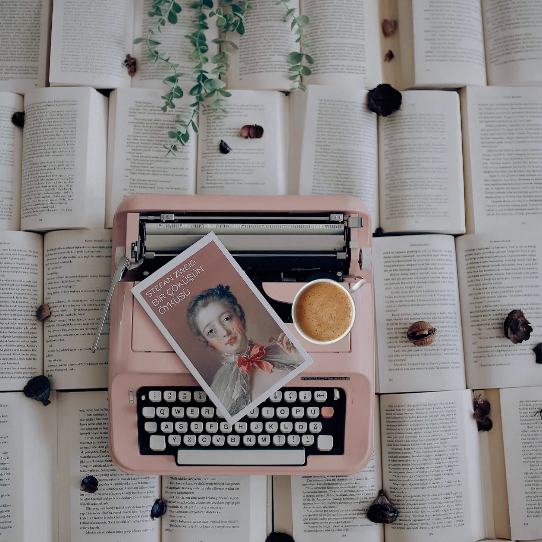 a typewriter and book on top of book pages