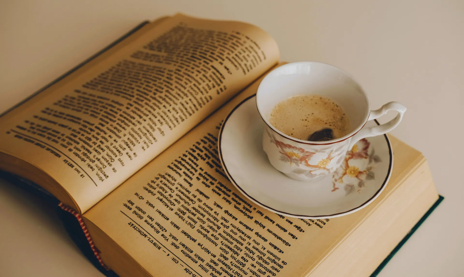 reading book with a cup of tea