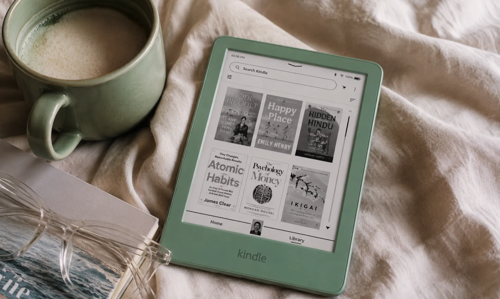 best-kindle-to-buy-in-2026 kindle matcha as the best kindle to buy in 2026, with a cup of coffee ang glasses