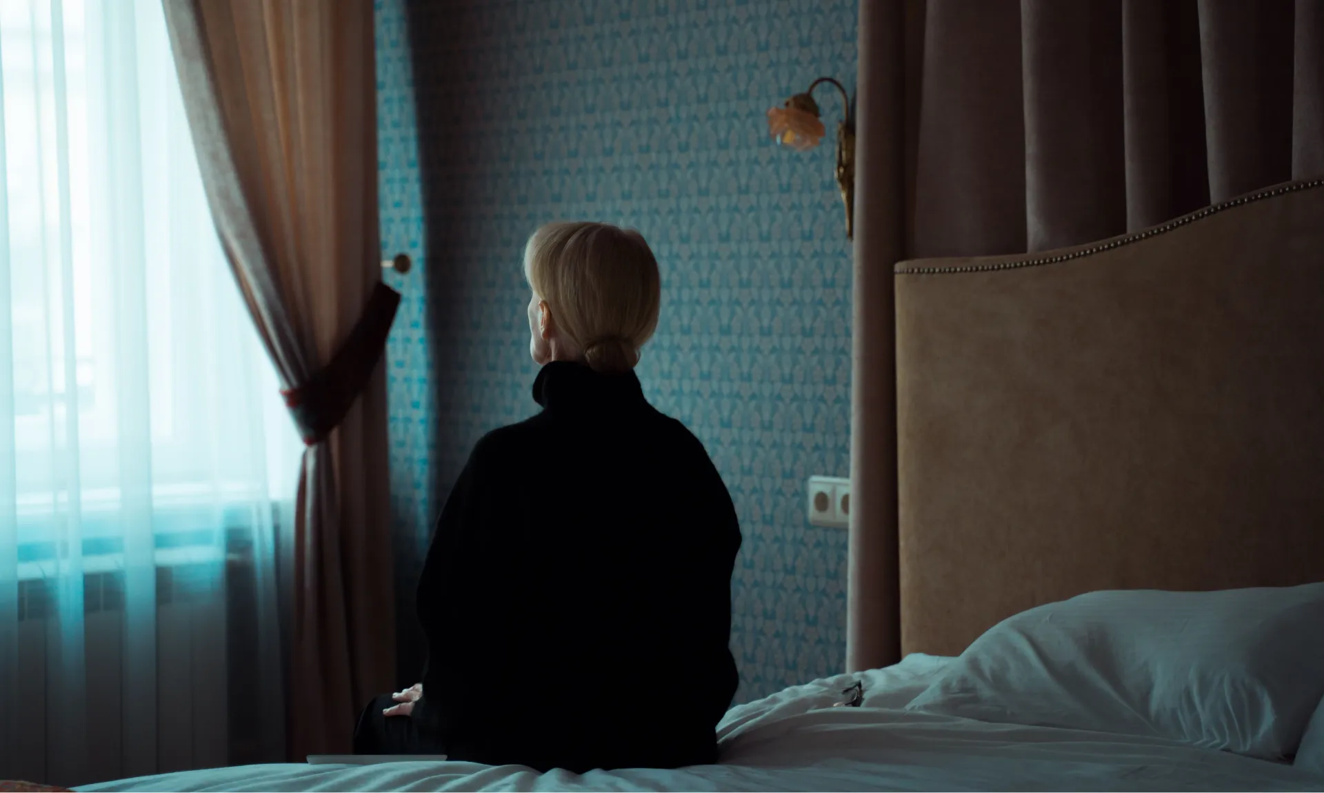sad-woman-sitting-alone sad woman sitting alone representing loneliness
